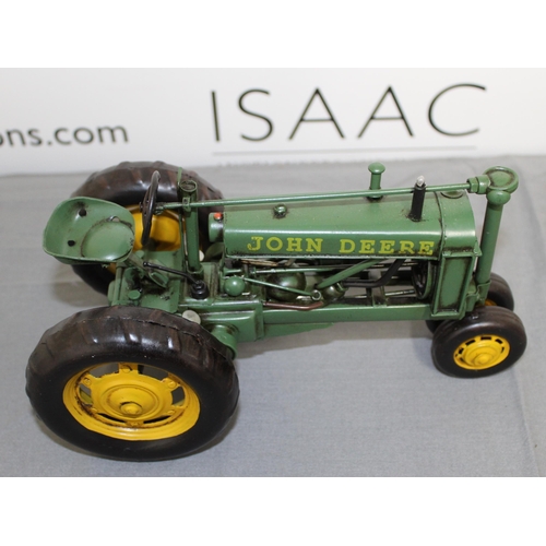 684 - Boxed Tin Plate John Deere Tractor
Length 26cm