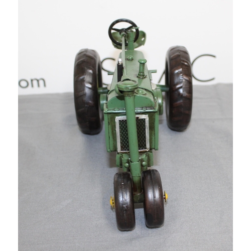 684 - Boxed Tin Plate John Deere Tractor
Length 26cm