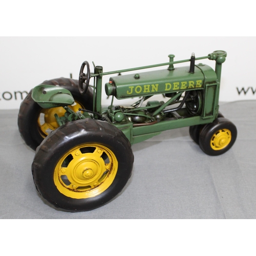 684 - Boxed Tin Plate John Deere Tractor
Length 26cm