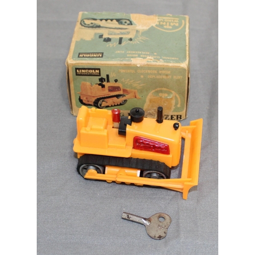 706 - Boxed Vintage Lincoln International Mini Windup Sparking Bulldozer