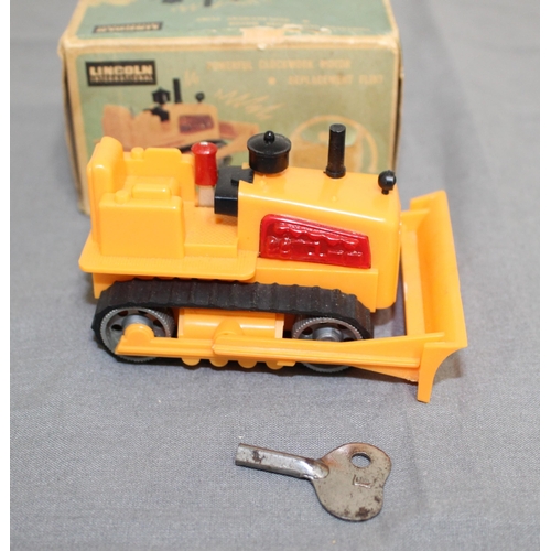 706 - Boxed Vintage Lincoln International Mini Windup Sparking Bulldozer