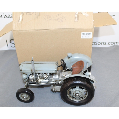 717 - Tin Plated Ferguson Tractor Boxed
Length 26cm