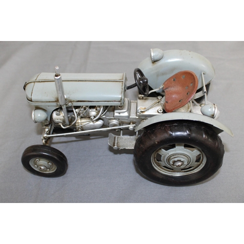 717 - Tin Plated Ferguson Tractor Boxed
Length 26cm