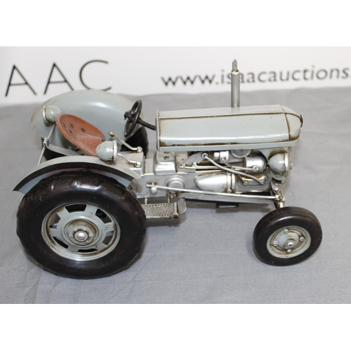 717 - Tin Plated Ferguson Tractor Boxed
Length 26cm