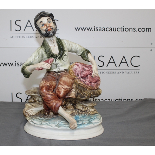 54 - A Capodimonte Style figure of a Fisherman
Damage Shown In Picture
Height 33cm
Collection Only