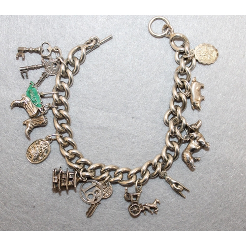 388 - Silver Charm Bracelet With 11 Charms In A Box