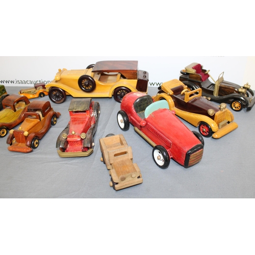 561 - A Collection Of Wooden Vintage Style Cars One Stamped Woodentops London,
Longest One 38cm