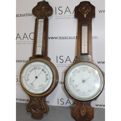 65 - Two Wooden Barometers 
Height 82cm
COLLECTION ONLY