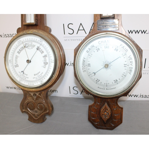 65 - Two Wooden Barometers 
Height 82cm
COLLECTION ONLY