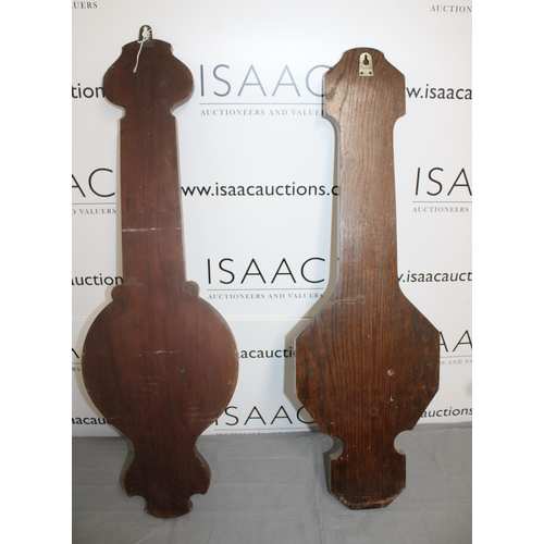 65 - Two Wooden Barometers 
Height 82cm
COLLECTION ONLY