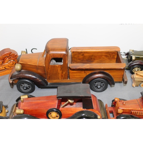 572 - Collection Of Wooden Vehicles Inc A Wooden Bike Puzzle 
Longest-37cm