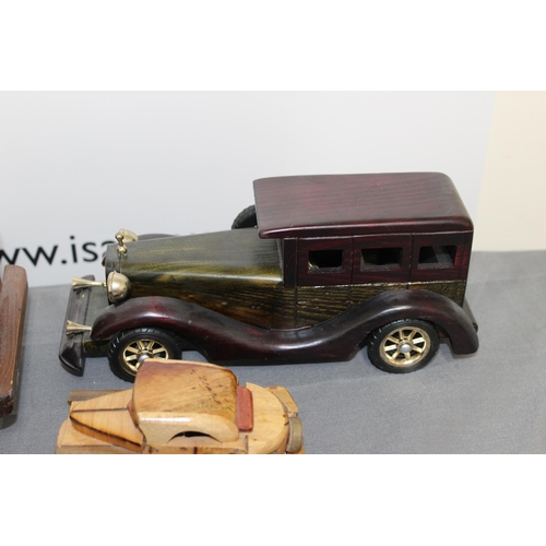 572 - Collection Of Wooden Vehicles Inc A Wooden Bike Puzzle 
Longest-37cm