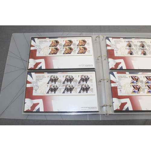 167 - London 2012 Team GB Gold Medal Winners Stamp Collectors Packs in Album