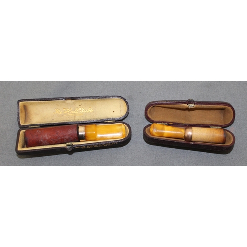 99 - Two Cased Yellow Metal Cheroots