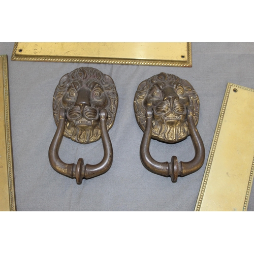 12 - Two Brass Lion Knockers & Three Sets Of Door Plates