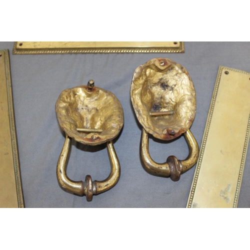 12 - Two Brass Lion Knockers & Three Sets Of Door Plates