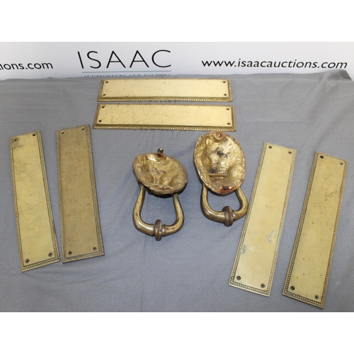 12 - Two Brass Lion Knockers & Three Sets Of Door Plates