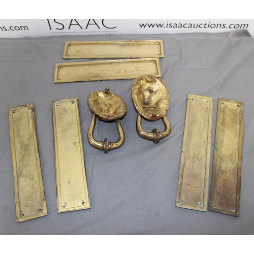 12 - Two Brass Lion Knockers & Three Sets Of Door Plates