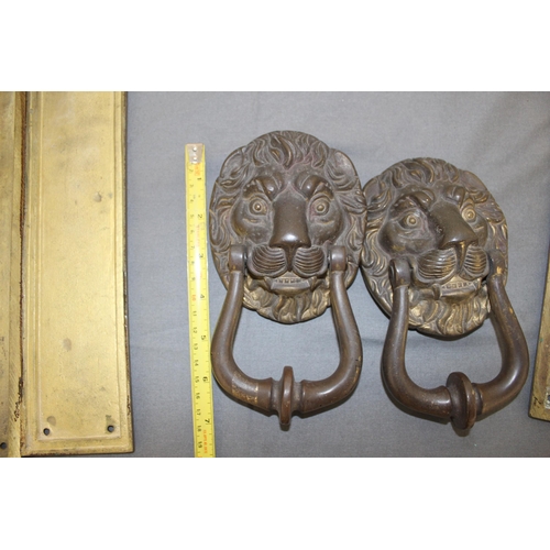 12 - Two Brass Lion Knockers & Three Sets Of Door Plates