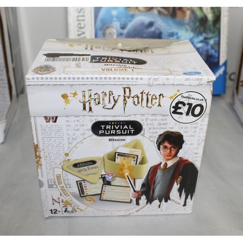 663 - A Collection Of Harry Potter Items Including Puzzles, Plushies, Trivial Pursuit And Collectable Wand... 