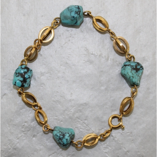 533 - Stamped 750 Gold And Turquoise Bracelet
In A Box
Total Weight 8.92g