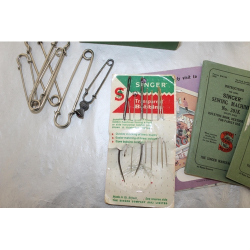 131 - Singer Sewing Machine Accessories And Large Pins