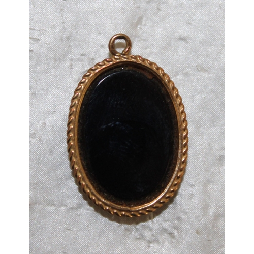 543 - Stamped 375 Gold Black Onyx Oval Pendant Total Weight 1.89g