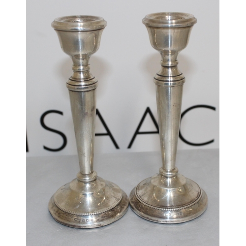 499 - A Pair Of Silver Hallmarked Candle Sticks
Height 15.5 cm