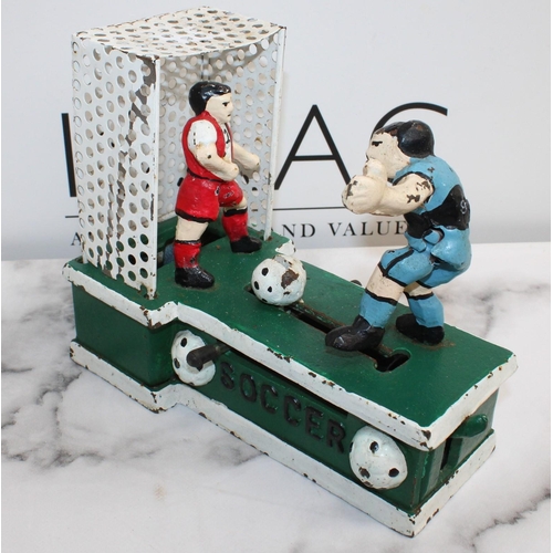 38 - Vintage Cast Iron Mechanical Soccer Coin Bank 
Length-19.5cm
All Proceeds Go To Charity
