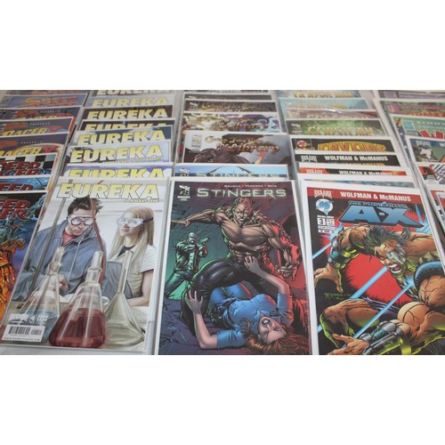 25 - A Large Quantity Of Comics Including, Speed Racer, Speed Racer X, Eureka, Stingers, Serinity, Tomb R...