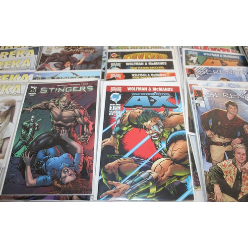 25 - A Large Quantity Of Comics Including, Speed Racer, Speed Racer X, Eureka, Stingers, Serinity, Tomb R...