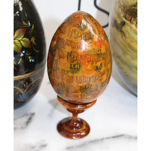 181 - Eleven Russian Wooden/Metal Hand Painted Decorative Eggs Largest-29cm Some On Stands