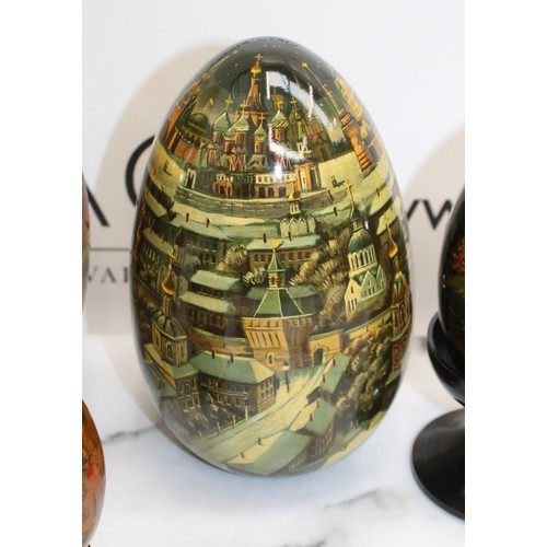 181 - Eleven Russian Wooden/Metal Hand Painted Decorative Eggs Largest-29cm Some On Stands