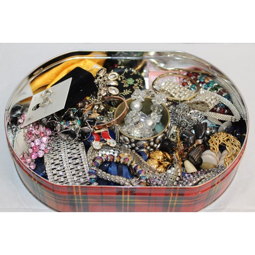 410 - A Quantity Of Mixed Jewellery Items In A Tin