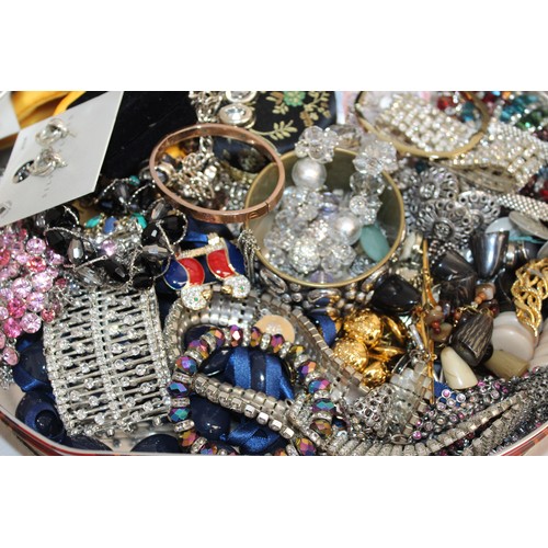 410 - A Quantity Of Mixed Jewellery Items In A Tin