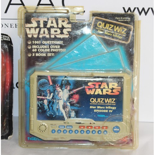 660 - 4 x Star-Wars Books And 2 x Boxed Star-wars Toys 
Electromic Comm Talk Untested
Star-Wars Quiz Whizz... 