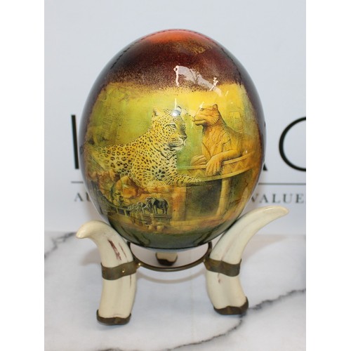 129 - 2 x Decorative Ostrich Eggs With Stands (One Stand Damaged As Shown In Pictures)
Height-14.5cm
COLLE... 