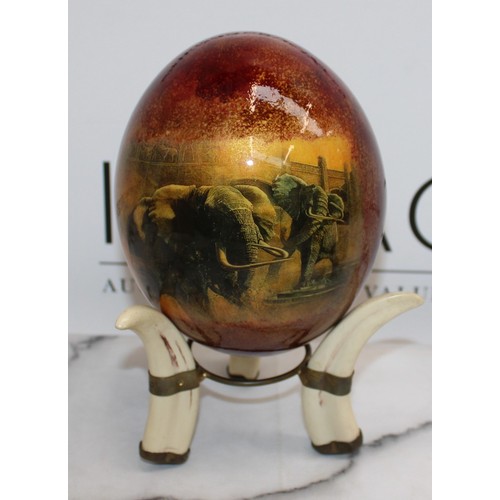 129 - 2 x Decorative Ostrich Eggs With Stands (One Stand Damaged As Shown In Pictures)
Height-14.5cm
COLLE... 