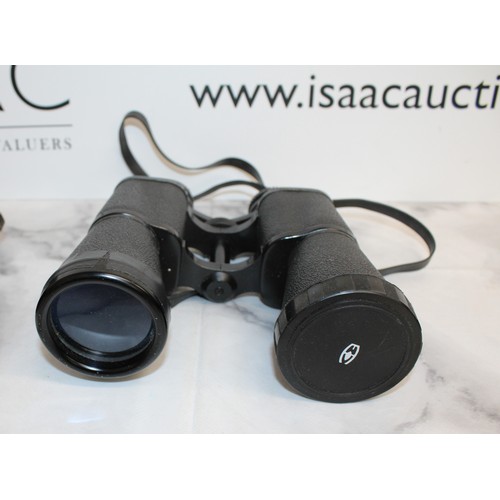 133 - A Selection Of Binoculars Four in Cases And One Without All Untested