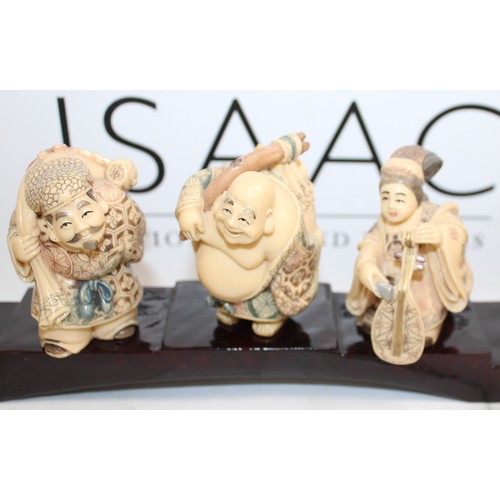 231 - 7 Decorative Japanese Immortals On A Plinth Length-46cm Height Of Figures Tallest 8cm