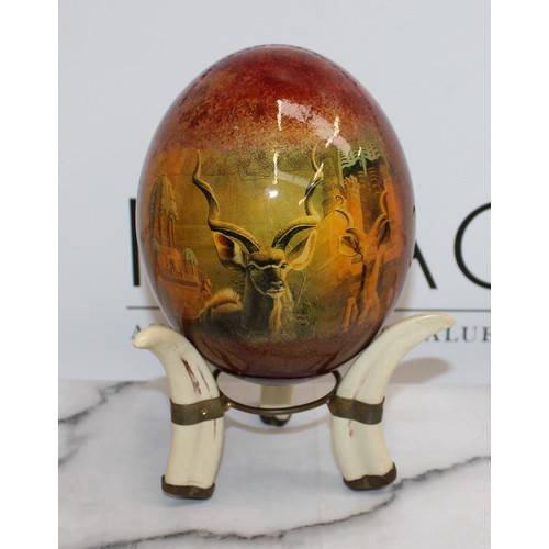 92 - 2 x Decorative Ostrich Eggs With Stands (One Stand Damaged As Shown In Pictures)
Height-14.5cm
COLLE... 