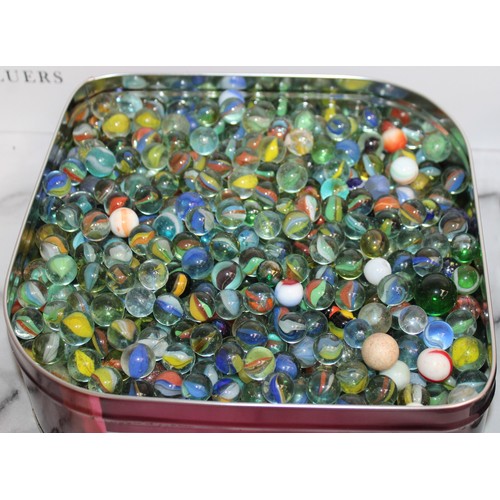 97 - A Large Quantity Of Marbles In Tins