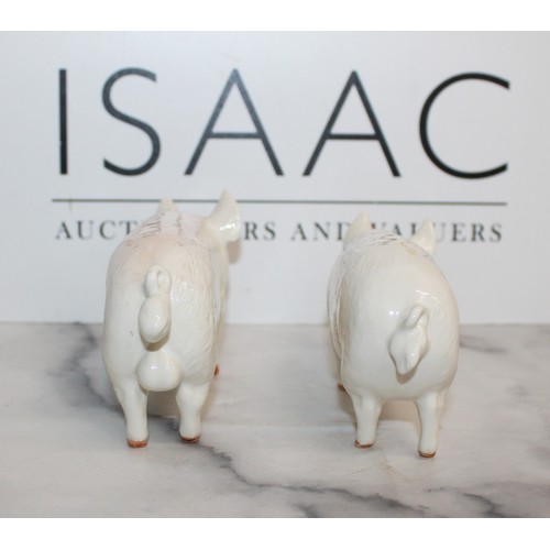 117 - 2 x Beswick Pigs (Boar And Sow) 
Length 17cm
Collection Only