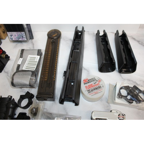 282 - A Quantity Of Air Soft Accessories Including, Silencers, Magazines, BB Bullets, Brackets, Stocks And... 