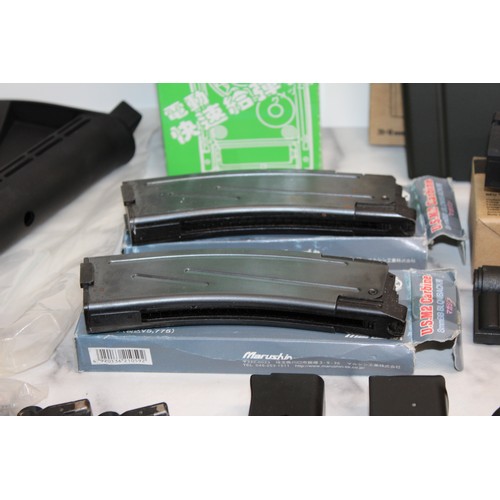 282 - A Quantity Of Air Soft Accessories Including, Silencers, Magazines, BB Bullets, Brackets, Stocks And... 