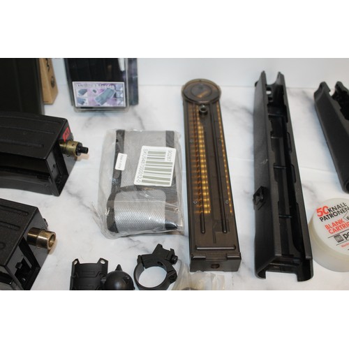 282 - A Quantity Of Air Soft Accessories Including, Silencers, Magazines, BB Bullets, Brackets, Stocks And... 