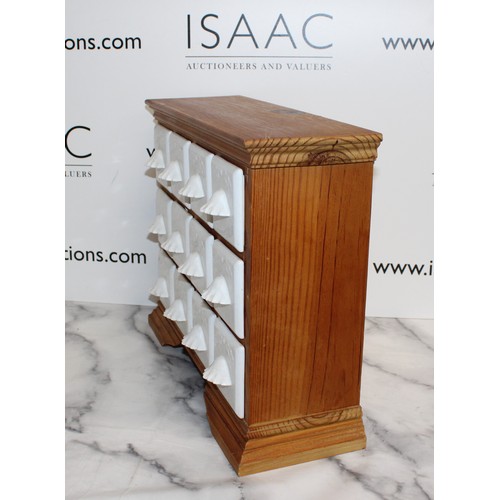 142 - A Wooden Spice Rack With Ceramic Draws H:36cm L:44cm
COLLECTION ONLY