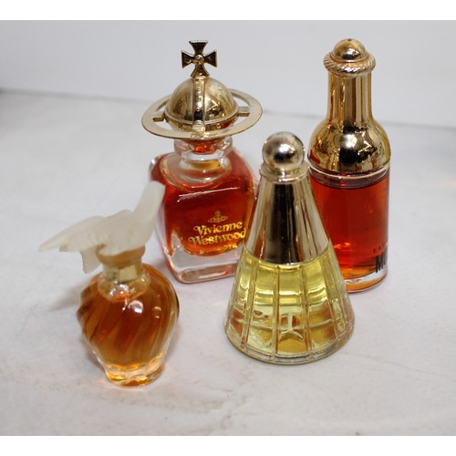 151 - A Selection Of Collectable Miniature Perfume Bottles Majority Contain Perfume Tallest:9.5cm