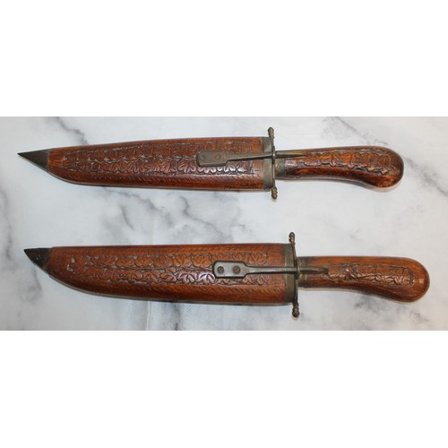 163 - 2 x Decorative Carved Wood Indian Daggers In Sheaths 
COLLECTION ONLY
OVER 18 ID WILL NEED TO BE PRO... 