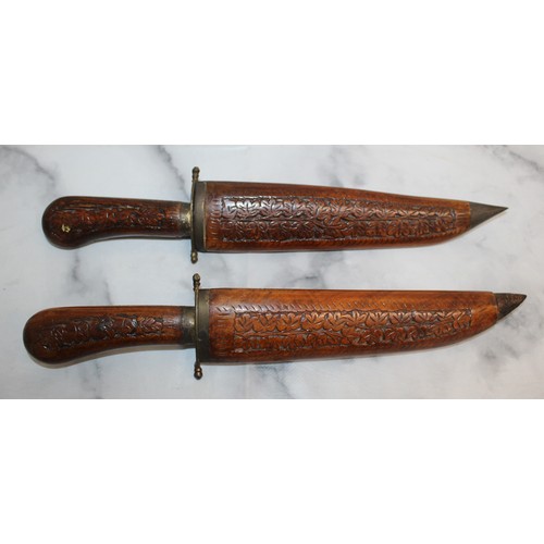 163 - 2 x Decorative Carved Wood Indian Daggers In Sheaths 
COLLECTION ONLY
OVER 18 ID WILL NEED TO BE PRO... 